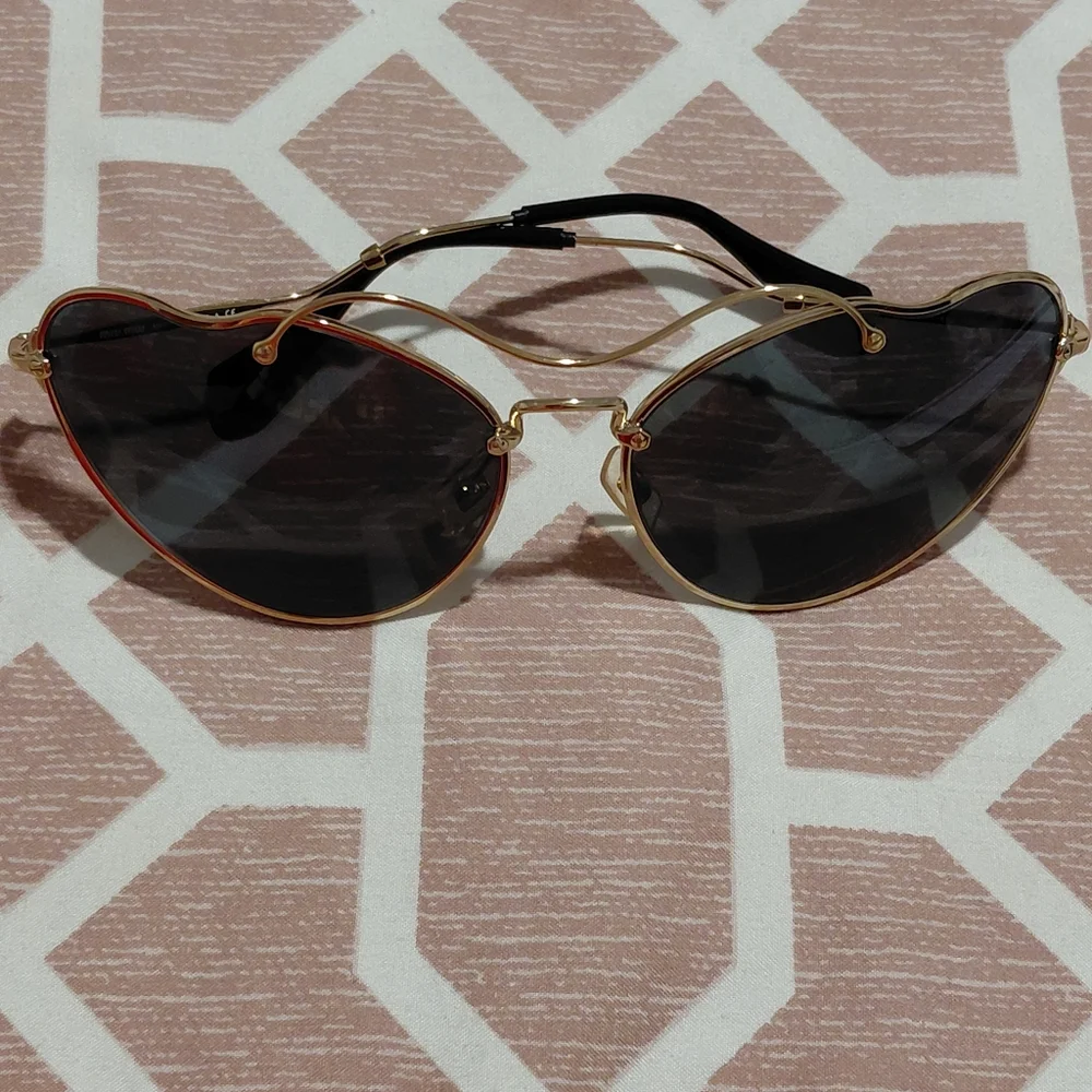 Miu Miu Gold Frame Sunglasses with Black Lenses